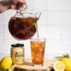 Iced tea made with Good Morning Honey creamed honey being poured into a glass