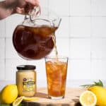 Iced tea made with Good Morning Honey creamed honey being poured into a glass