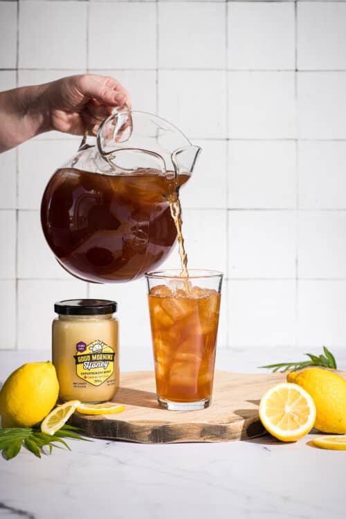 Iced tea made with Good Morning Honey creamed honey being poured into a glass