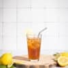 glass of iced tea with a straw, sweetened with Good Morning Honey