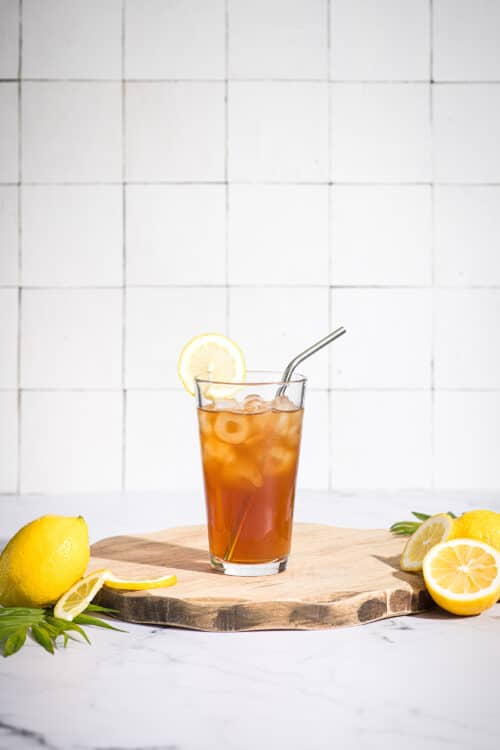 glass of iced tea with a straw, sweetened with Good Morning Honey