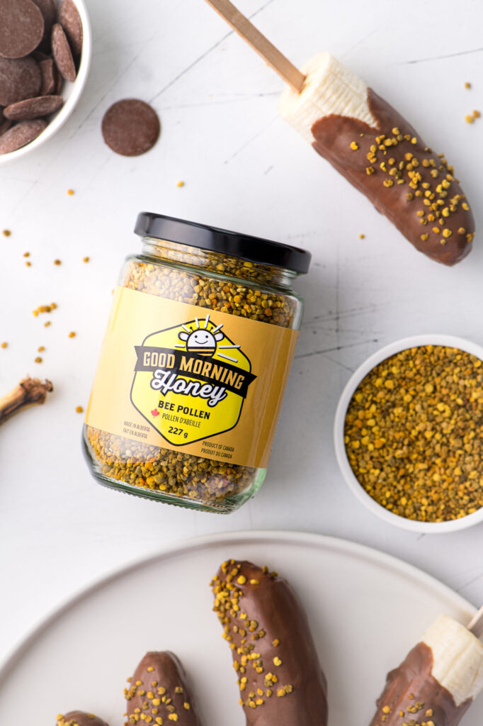 A jar of Good Morning Honey bee pollen and bananas dipped in chocolate and topped with bee pollen.