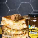 a grilled cheese sandwich with pear, gruyere, and blueberry honey