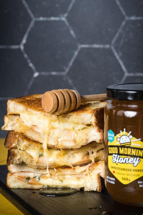 a grilled cheese sandwich with pear, gruyere, and blueberry honey