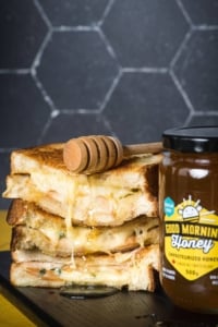 a grilled cheese sandwich with pear, gruyere, and blueberry honey